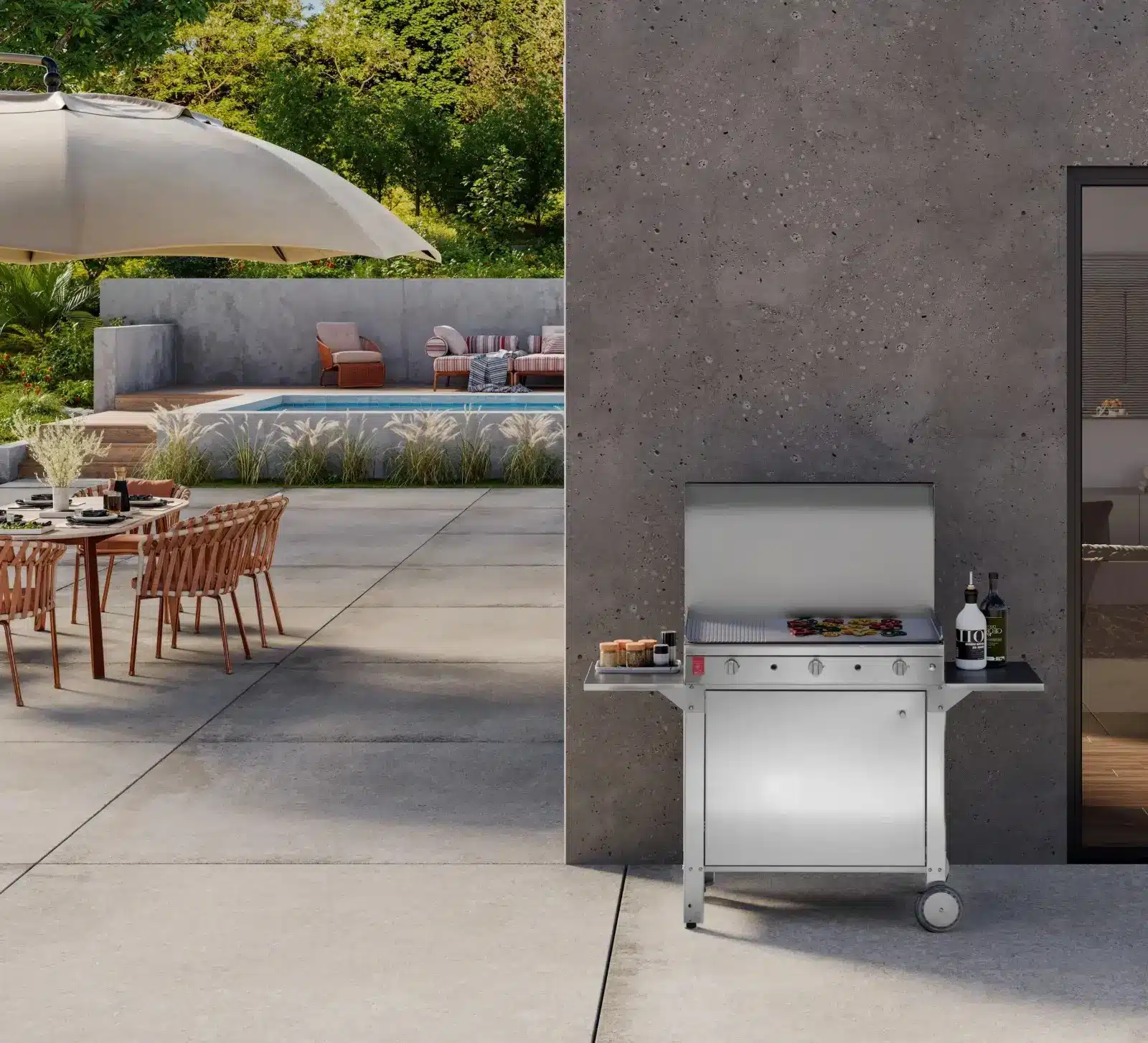 Barbecue a gas in acciaio accanto alla piscina